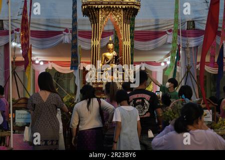 Inthakin Festival or Sai Khan Dok tradition are The citizens of Chiang Mai offering flowers for city pillar at Wat Chedi Luang in Chiang Mai, Thailand Stock Photo