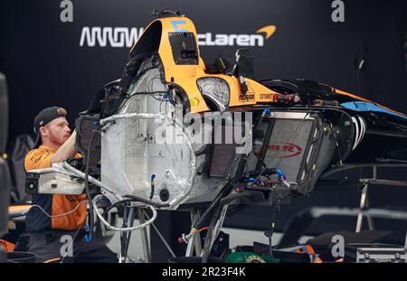 Indianapolis, United States. 16th May, 2023. A teammate works on IndyCar driver Pato O'Ward's (5) race car in the garage on day one of practice for the 2023 Indy 500 at Indianapolis Motor Speedway in Indianapolis. The practice was rained out. Credit: SOPA Images Limited/Alamy Live News Stock Photo
