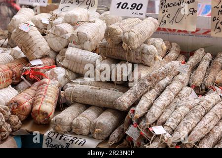 Cremona, Italy - September 7, 2022: Traditional meat products sold at a street stall during the farmers market in Cremona, Lombardy, Italy Stock Photo