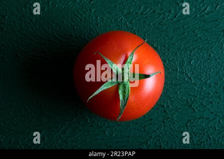 Fresh grape tomato on green background,closeup Stock Photo