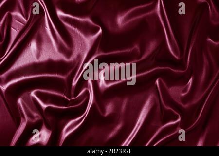 Silk fabric, abstract wavy vinous satin fabric background Stock Photo
