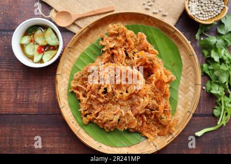 Shrimp fritters, deep fried small shrimp served cucumber dipping sauce at top view Stock Photo