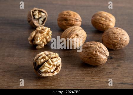 Cracked and whole walnuts together,close-up Stock Photo