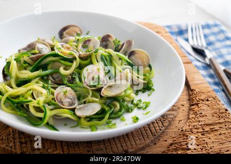 Zucchini strips cooked with clams. Stock Photo