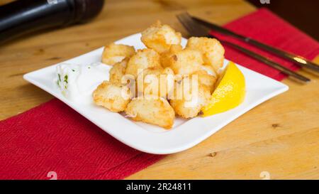 Txokos. Spanish tapa of fried squid. Stock Photo