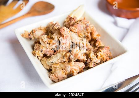 Spanish tapa of fried squid. Stock Photo