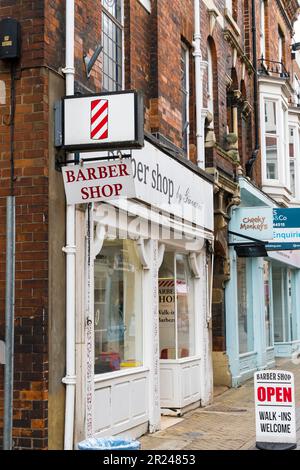 Red and white candy stripe Barber shop sign, Guildhall Street Lincoln city 2023 Stock Photo