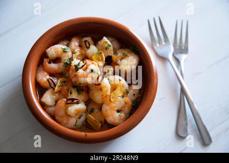 Gambas al ajillo. Shrimp Scampi. Traditional tapa recipe from the south of Spain cooked with seafood and sautéed garlic. Stock Photo