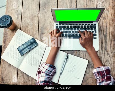 Woman, hands and laptop of student on green screen mockup above for studying, education or research at cafe. Top view of female person hand on Stock Photo