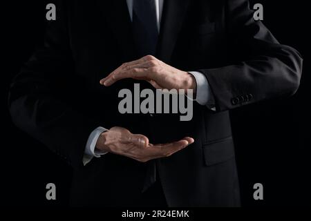 A pair of male hands holding the virtual Earth Stock Photo