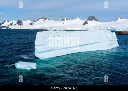 Half Moon Island, Antarctica. An iceberg in the cold waters of Half Moon Island, a common stopping place for ships on the way to Antarctica. Stock Photo