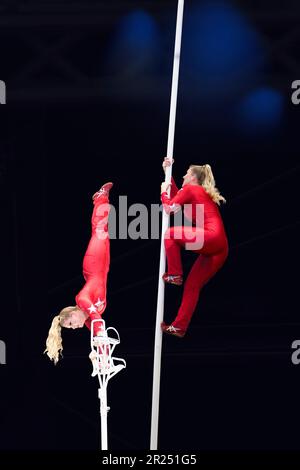 Girl circus acrobat gymnast on stage on a dark background Stock Photo ...