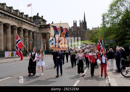 Edinburgh, Scotland, UK. 17th May 2023. Organised by the Royal Norwegian Consulate General, this year’s celebration of Norwegian Constitution day, with a parade and march from Cockburn Street along the High Street, finishing at the memorial stone in Princes Street Gardens with a ceremony. The march walking down the mound. Credit: Craig Brown/Alamy Live News Stock Photo