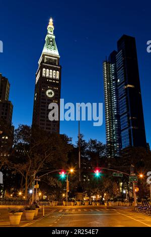 Metropolitan Life Insurance Company Tower and construction lights of a new condo building light the dawn sky above Manhattan’s Madison Square Park. Stock Photo