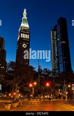 Metropolitan Life Insurance Company Tower and construction lights of a new condo building light the dawn sky above Manhattan’s Madison Square Park. Stock Photo