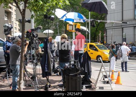 Media and spectators gather outside a New York State Court awaiting the Donald Trump libel case, 9 May 2023, USA Stock Photo