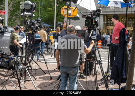 Media and spectators gather outside a New York State Court awaiting the Donald Trump libel case, 9 May 2023, USA Stock Photo