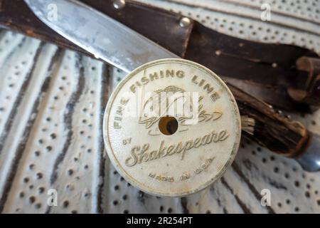 Vintage Spool of Shakespeare fine fishing line along side a large hunting  knife, 2023, USA Stock Photo - Alamy