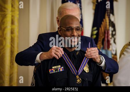 Washington, United States. 17th May, 2023. President Joe Biden presents Sergeant Kendrick Simpo Houston Police Department in Texas with the Public Safety Officer Medal of Valor during a ceremony in the East Room of the White House on May 16, 2023 in Washington, DC The Medal of Valor is the highest decoration that can be awarded to a Public Safety Officer for acts of bravery. (Photo by Samuel Corum/Sipa USA) Credit: Sipa USA/Alamy Live News Stock Photo