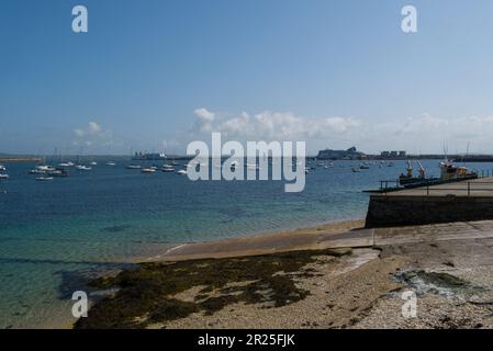 View across Holyhead marina with Stena Line ferry entering the harbour Isle of Anglesey North Wales UK with moored yachts and motorboats Stock Photo