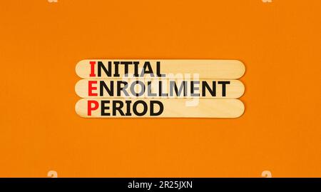 IEP symbol. Concept words IEP Initial enrollment period on beautiful wooden sticks. Beautiful orange table orange background. Medical and IEP Initial Stock Photo