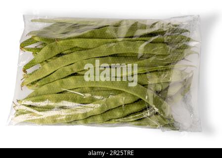 Runner beans packaged in clear plastic bag for sale isolated on white with clipping path included Stock Photo