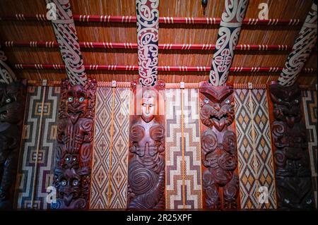 The ceremonial house at Waitangi is called the Whare Rūnanga. It is a significant structure located within the Waitangi Treaty Grounds in New Zealand. The Whare Rūnanga serves as a symbol of partnership and unity between Māori and the British Crown.  The Whare Rūnanga is a traditional Māori meeting house built in the style of a carved wharenui (large house). It was constructed in 1940 to commemorate the centenary of the signing of the Treaty of Waitangi Stock Photo