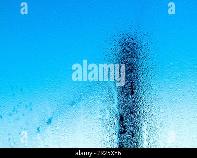 Abstract scene seen through condensation on window. Stock Photo