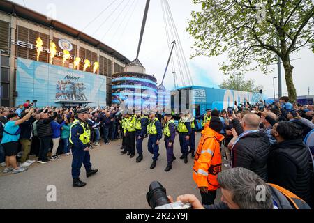 Police make way for the Manchester City team bus arriving ahead of the UEFA Champions League semi-final second leg match at Etihad Stadium, Manchester. Picture date: Wednesday May 17, 2023. Stock Photo