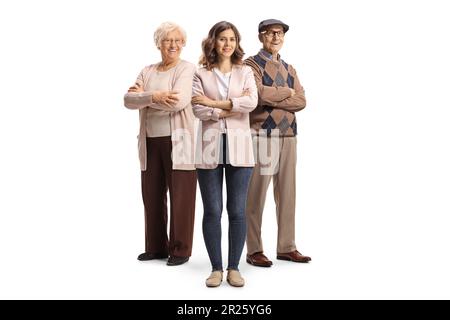 Young woman standing in front of an elderly man and woman isolated on white background Stock Photo