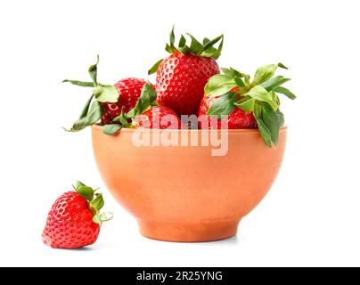 Ripe juicy large organic strawberries in a clay ceramic bowl isolated on a white background. Stock Photo