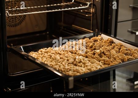 Peeled walnuts laid out on a baking sheet and dried in the oven Stock Photo