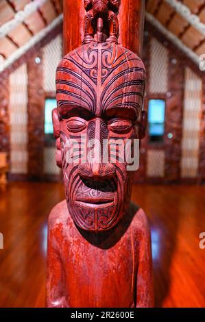 The ceremonial house at Waitangi is called the Whare Rūnanga. It is a significant structure located within the Waitangi Treaty Grounds in New Zealand. The Whare Rūnanga serves as a symbol of partnership and unity between Māori and the British Crown.  The Whare Rūnanga is a traditional Māori meeting house built in the style of a carved wharenui (large house). It was constructed in 1940 to commemorate the centenary of the signing of the Treaty of Waitangi Stock Photo