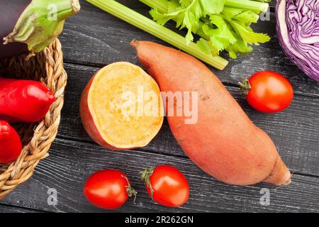 sliced sweet potato on wood background Stock Photo