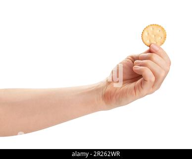 round cracker in hand path isolated on white Stock Photo