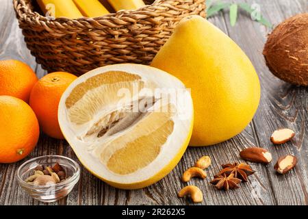 sliced pomelo on wood background Stock Photo