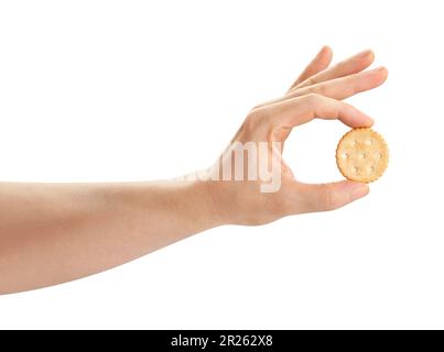 round cracker in hand path isolated on white Stock Photo