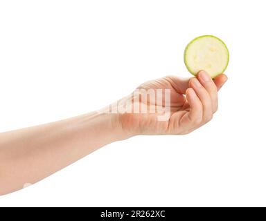 sliced zucchini in hand path isolated on white Stock Photo