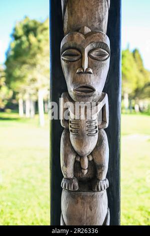 The ceremonial house at Waitangi is called the Whare Rūnanga. It is a significant structure located within the Waitangi Treaty Grounds in New Zealand. The Whare Rūnanga serves as a symbol of partnership and unity between Māori and the British Crown.  The Whare Rūnanga is a traditional Māori meeting house built in the style of a carved wharenui (large house). It was constructed in 1940 to commemorate the centenary of the signing of the Treaty of Waitangi Stock Photo