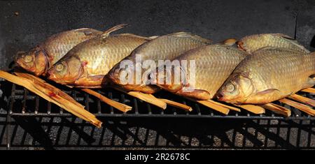 Smoked fish in a the mobile smoke hut. Stock Photo