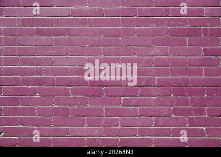 Purple and Black brick building. Abstract Background. Seamless purple and black brick Facade. Stock Photo