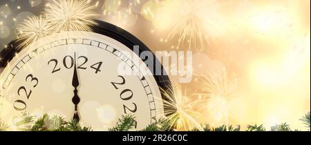 Change from 2023 to 2024 New Year s Eve clock on magic fireworks background. Stock Photo