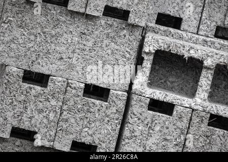 Arbolite blocks close up photo, this construction material is lightweight concrete based on cement binder, organic aggregates and chemical additives. Stock Photo