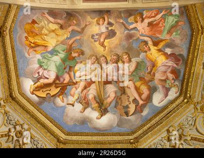 GENOVA, ITALY - MARCH 6, 2023: The ceiling fresco of Choir of angels with the music instruments in the church Chiesa di Santa Caterina Stock Photo