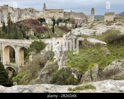 Gravina in Puglia, Italy. Panorama from the archeological site, with view of Ponte Acquedotto over the ravine and the buildings in the old city. Stock Photo