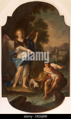 NAPLES, ITALY - APRIL 20, 2023: The painting of Thobias and Archangel Raphael in the church Chiesa di Sant' Antonio a Posillipo by Giacinto Diano Stock Photo
