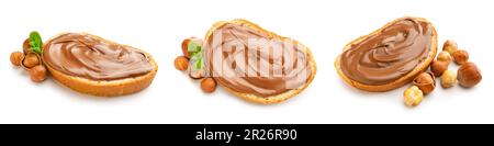 Set of fresh bread with chocolate paste and hazelnuts on white background Stock Photo