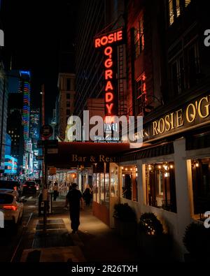 Rosie OGradys vintage neon sign at night, Manhattan, New York Stock