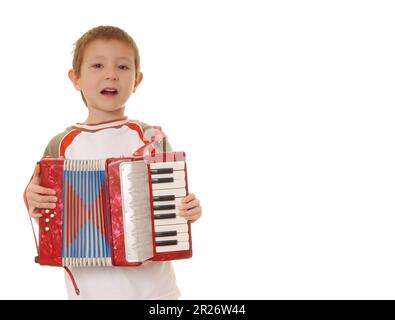 Isolated young boy playing a diatonic accordion Stock Photo