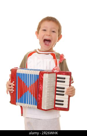 Isolated young boy playing a diatonic accordion Stock Photo